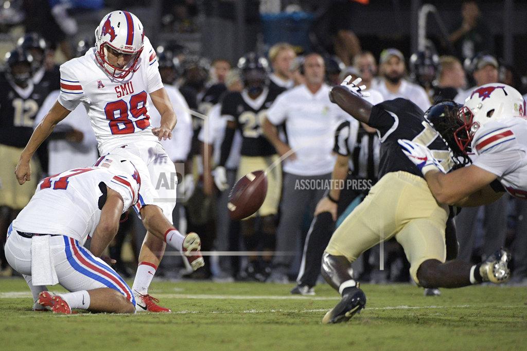 Phelan M. Ebenhack SMU place kicker Kevin Robledo (89) makes a 31-yard field goal in front of Central Florida defensive back Nevelle Clarke (14) during the first half of an NCAA college football game Saturday, Oct. 6, 2018, in Orlando, Fla. (AP Photo/Phelan M. Ebenhack)