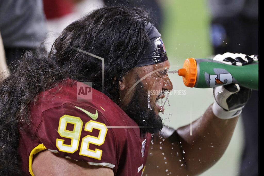 Ron Schwane Washington Redskins defensive tackle Austin Maloata cools off during the second half of the team's NFL preseason football game against the Cleveland Browns, Thursday, Aug. 8, 2019, in Cleveland. (AP Photo/Ron Schwane)