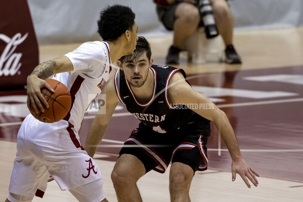 Vasha Hunt Western Kentucky guard Luke Frampton (14) guards Alabama guard Jahvon Quinerly (13) during the first half of an NCAA college basketball game, Saturday, Dec. 19, 2020, in Tuscaloosa, Ala. (AP Photo/Vasha Hunt)