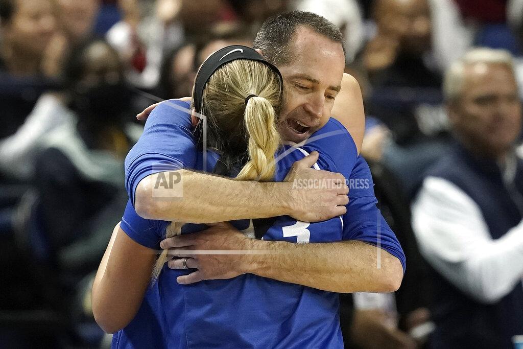 Gerry Broome Creighton head coach Jim Flanery hugs guard Payton Brotzki late in the second half of a college basketball game against South Carolina in the Elite 8 round of the NCAA tournament in Greensboro, N.C., Sunday, March 27, 2022. (AP Photo/Gerry Broome)