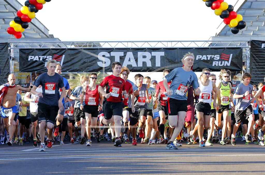 FILE - In this April 20, 2013, file photo, runners start the 9th annual Pat's Run in Tempe, Ariz. Pat's Run annually draws 30,000 people to run in honor former NFL player and soldier Pat Tillman. The coronavirus pandemic forced organizers join several other races in shifting it to a virtual event. (AP Photo/Matt York, File)