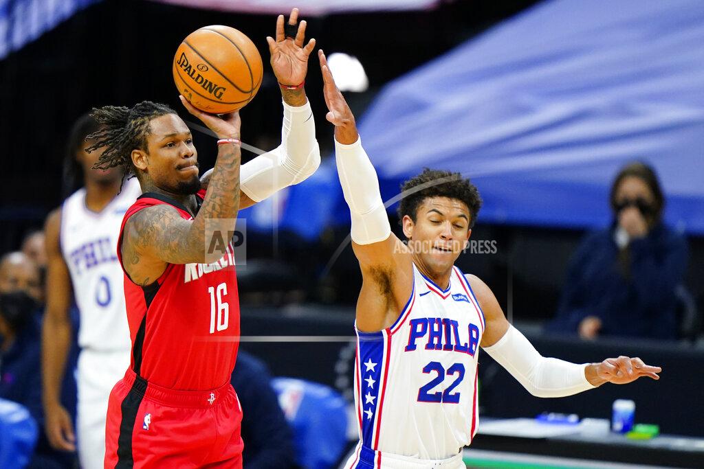 Matt Slocum Houston Rockets' Ben McLemore, left, goes up for a shot against Philadelphia 76ers' Matisse Thybulle during the first half of an NBA basketball game, Wednesday, Feb. 17, 2021, in Philadelphia. (AP Photo/Matt Slocum)