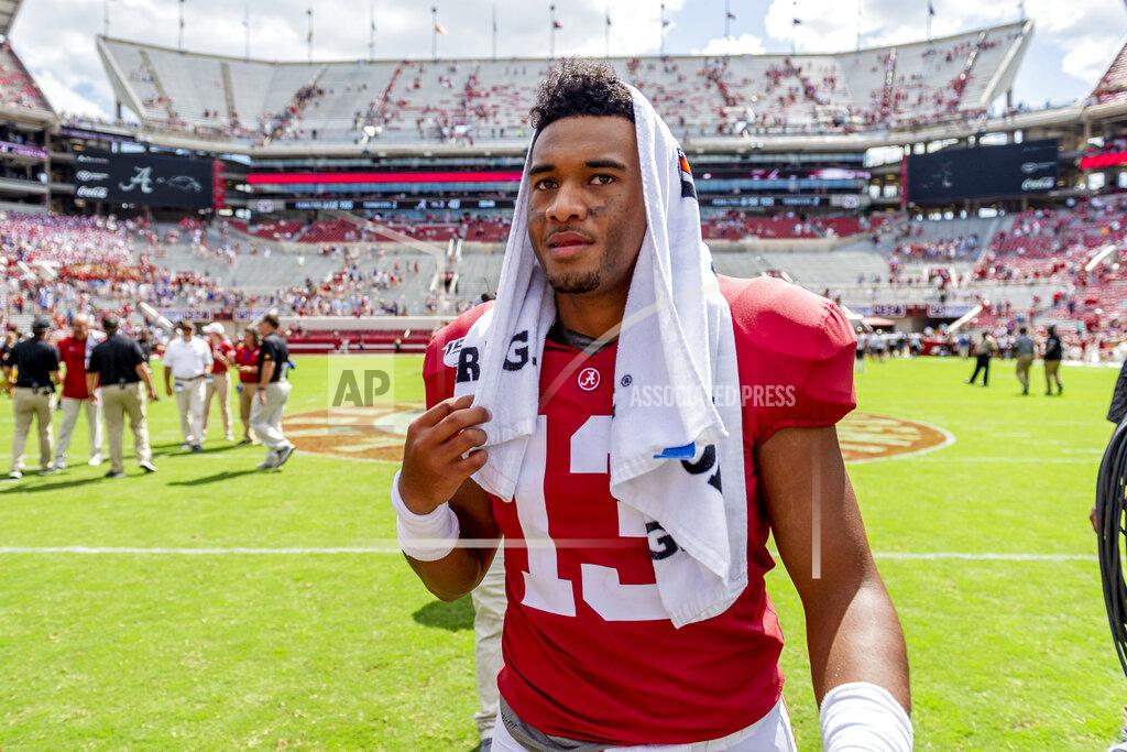 Vasha Hunt Alabama quarterback Tua Tagovailoa (13) walks off the field victorious celebrate after a 49-7 win over Southern Miss in an NCAA college football game, Saturday, Sept. 21, 2019, in Tuscaloosa, Ala. (AP Photo/Vasha Hunt)
