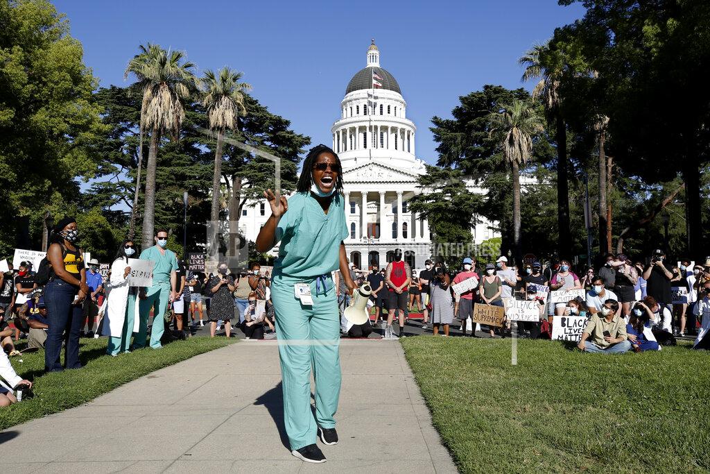 Rich Pedroncelli Dr. Zola Chihombori Quao speaks at a rally near the California Capitol in Sacramento, Calif., of medical care professionals,, denouncing the death of George Floyd, who died after being restrained by Minneapolis police on May 25. (AP Photo/Rich Pedroncelli)
