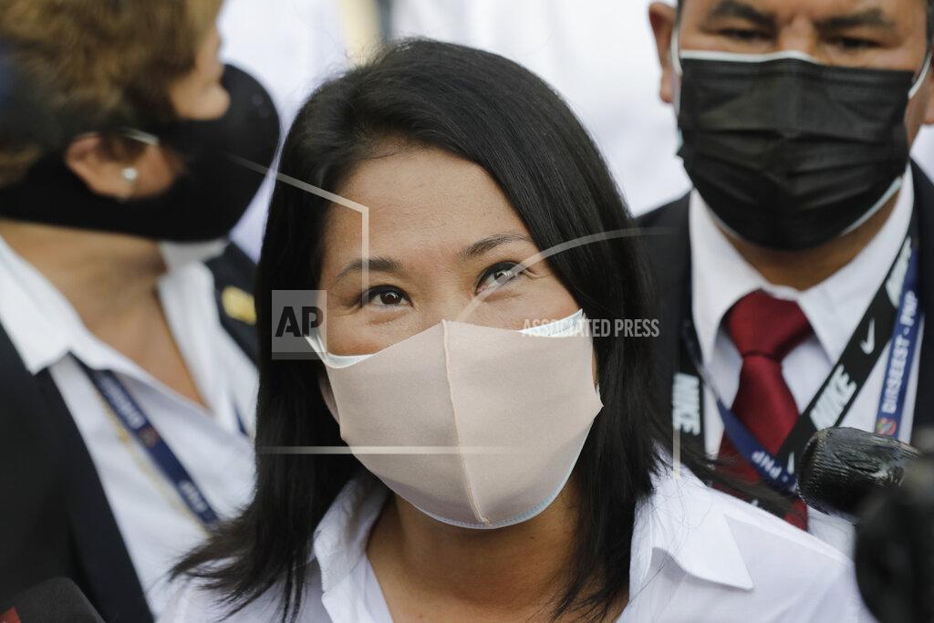 Guadalupe Pardo Keiko Fujimori, daughter of imprisoned ex-President Alberto Fujimori and presidential candidate for the Popular Force party, talks to journalists after voting during general elections in Lima, Peru, Sunday, April 11, 2021. Peruvians went to the polls amid a surge in new COVID-19 infections.(AP Photo/Guadalupe Pardo)