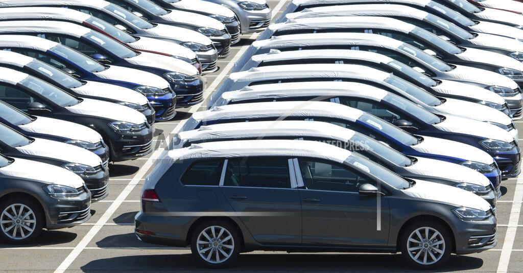 Jens Meyer Volkswagen cars stand at a parking area during the production restart of the plant of the German manufacturer Volkswagen AG (VW) in Zwickau, Germany, Thursday, April 23, 2020. Volkswagen starts with step-by-step resumption of production. The car company are completely converting the plant in Zwickau from 100 percent combustion engine to 100 percent electric. (AP Photo/Jens Meyer)