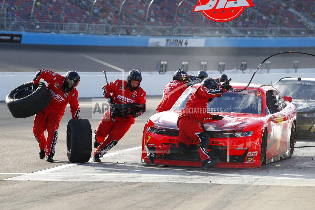 Ralph Freso The pit crew for Justin Allgaier (7) scramble around the race car to change tires during a pit stop in a NASCAR Xfinity Series auto race at Phoenix Raceway, Saturday, Nov. 7, 2020, in Avondale, Ariz. (AP Photo/Ralph Freso)