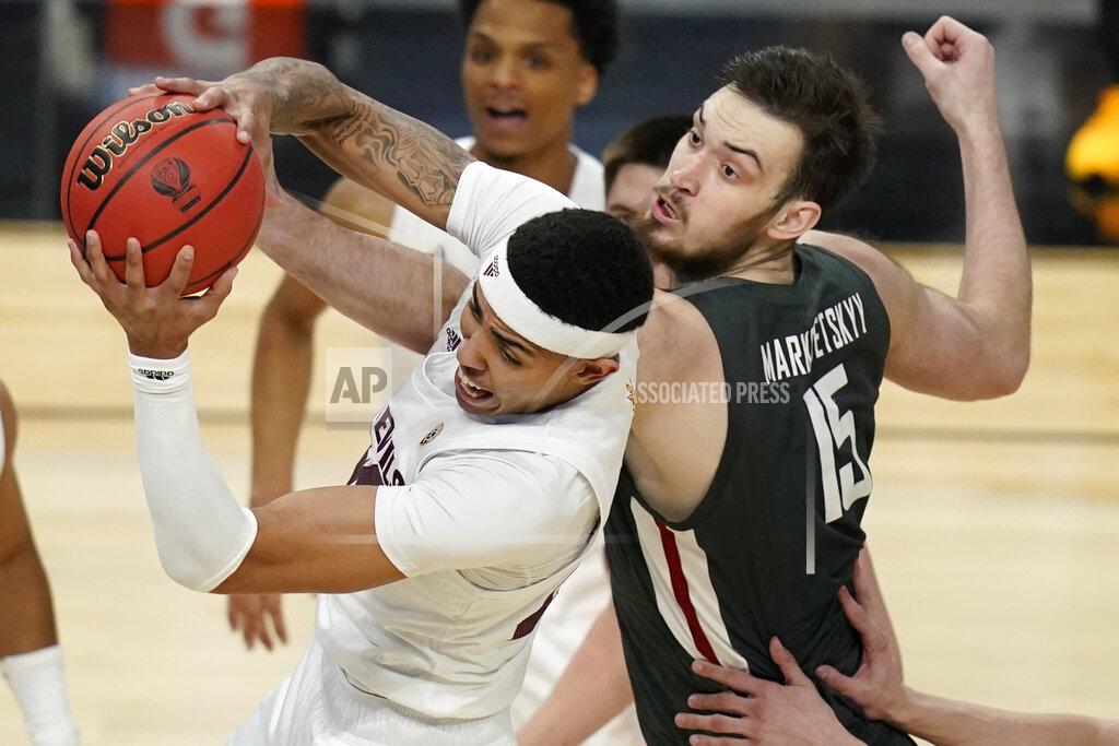 John Locher FILE - Arizona State's Jalen Graham, left, grabs a rebound over then-Washington State's Volodymyr Markovetskyy (15) during the first half of an NCAA college basketball game in the first round of the Pac-12 men's tournament Wednesday, March 10, 2021, in Las Vegas. Ukrainians playing college basketball in the United States have tried to keep up their routines as Russia invades their home country. Markovetskyy is now playing fort San Francisco. Markovetskyy's mother and sister were able to escape to Lithunia, but his father, a police officer, had to stay in Ukraine.(AP Photo/John Locher, File)
