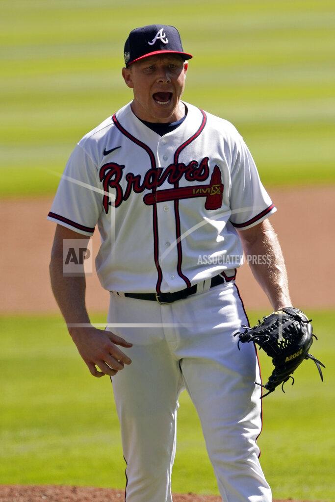 John Bazemore Atlanta Braves relief pitcher Mark Melancon (36) reacts after their final out against the Cincinnati Reds in Game 2 of a National League wild-card baseball series, Thursday, Oct. 1, 2020, in Atlanta. (AP Photo/John Bazemore)