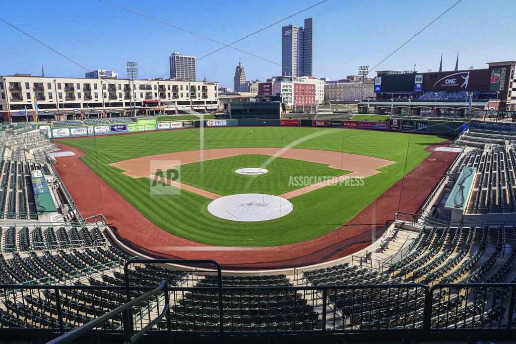 Mike Moore Downtown Fort Wayne, Ind., is seen from an empty Parkview Field on Wednesday, April 8, 2020. Mike Nutter is surrounded by questions everywhere he goes these days. So the longtime president of the Fort Wayne TinCaps is planning for every scenario he can imagine, one at a time. While Major League Baseball tries to figure out a way to play this summer, the prospects for anything resembling a normal minor league season are looking increasingly bleak. For minor league communities across the country, looking forward to cheap hot dogs, fuzzy mascot hugs and various theme nights, it's a small slice of a depressing picture. (Mike Moore/The Journal-Gazette via AP)