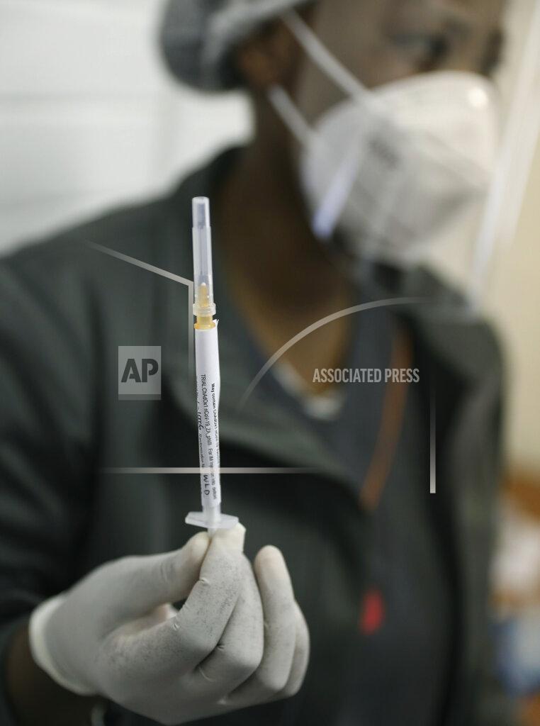 Siphiwe Sibeko FILE - In this Wednesday, June 24, 2020 file photo, a medical staff member prepares a syringe, at the Chris Hani Baragwanath hospital in Soweto, Johannesburg. Refrigeration, cargo planes, and, above all, money: All risk being in short supply for the international initiative to get coronavirus vaccines to the world’s most vulnerable people. (AP Photo/Siphiwe Sibeko, File)