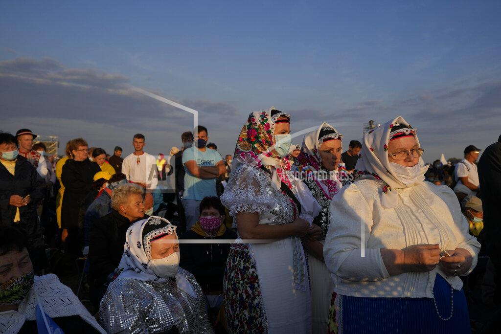 Petr David Josek Faithful wait for Pope Francis' arrival in the esplanade of the National Shrine in Sastin, Slovakia, Wednesday, Sept. 15, 2021. Pope Francis is to hold an open air mass in Sastin near the Slovakian capital on Wednesday, the site of an annual pilgrimage each September 15 to venerate Slovakia's patron, Our Lady of Sorrows. (AP Photo/Petr David Josek)