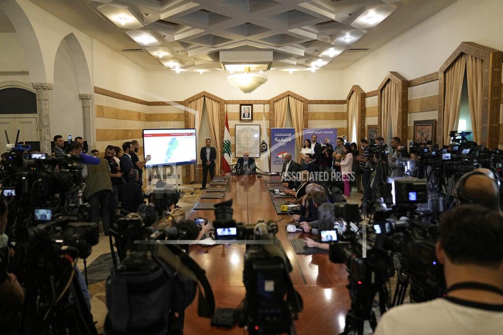 Hassan Ammar Lebanese Interior Minister Bassam Mawlawi, center, speaks during a press conference about Sunday's parliamentary elections, at the interior ministry in Beirut, Lebanon, Monday, May 16, 2022. Lebanon's militant Hezbollah group and its allies suffered losses in this weekend's parliamentary elections, with preliminary results Monday showing some of their most vocal opponents picking up more seats and several of their traditional partners routed out of the legislature. (AP Photo/Hassan Ammar)