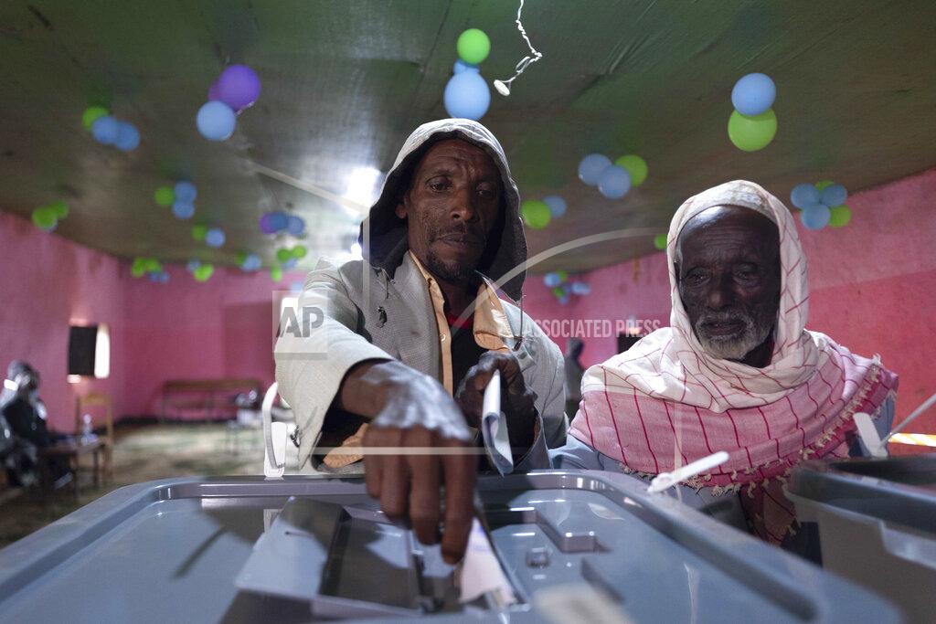 Mulugeta Ayene An Ethiopian man casts his vote in the general election, in Prime Minister Abiy Ahmed's home town of Beshasha, in the Oromia region of Ethiopia Monday, June 21, 2021. Ethiopia began voting Monday in the greatest electoral test yet for Prime Minister Abiy Ahmed as war and logistical issues meant ballots wouldn't be cast in more than 100 of the 547 constituencies across the country. (AP Photo/Mulugeta Ayene)