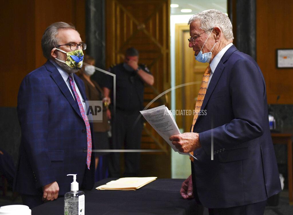 Kevin Dietsch EPA Administrator Andrew Wheeler, left, speaks with Sen. James Inhofe, R-Okla., before opening remarks during a Senate Environment and Public Works Committee oversight hearing to examine the Environmental Protection Agency, Wednesday, May 20, 2020 on Capitol Hill in Washington. (Kevin Dietsch/Pool via AP)