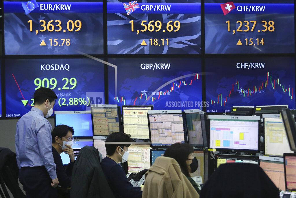 Ahn Young-Joon Currency traders watches monitors at the foreign exchange dealing room of the KEB Hana Bank headquarters in Seoul, South Korea, Friday, Feb. 26, 2021. Asian shares skidded Friday after rising bond yields triggered a broad sell-off on Wall Street that erased the markets gain for the week and handed the Nasdaq composite index its steepest loss since October. (AP Photo/Ahn Young-joon)