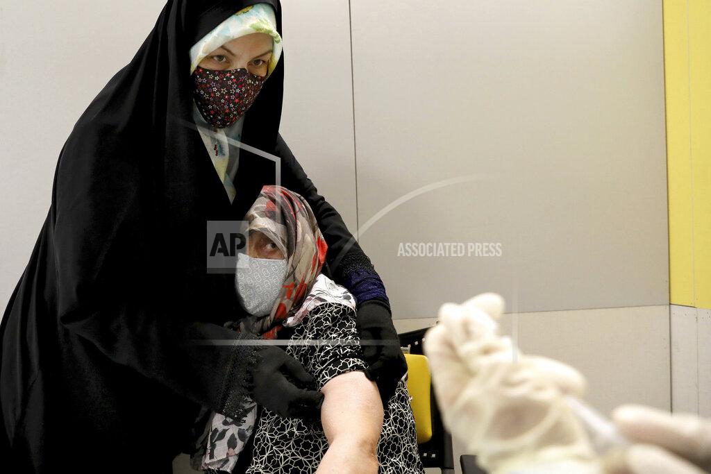 Ebrahim Noroozi An Iranian woman receives a Sinopharm vaccine for COVID-19 at the Iran Mall shopping center, in Tehran, Iran, Monday, May 17, 2021. Last month Iran started vaccinating elderly people against the coronavirus. (AP Photo/Ebrahim Noroozi)