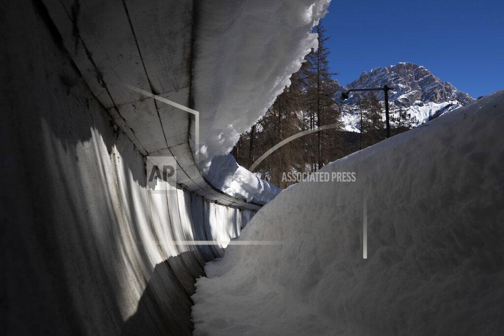Gabriele Facciotti A view of the bobsled track in Cortina d'Ampezzo, Italy, Wednesday, Feb. 17, 2021. Bobsledding tradition in Cortina goes back nearly a century and locals are hoping that the Eugenio Monti track can be reopened for the 2026 Olympics in the Italian resort. (AP Photo/Gabriele Facciotti)