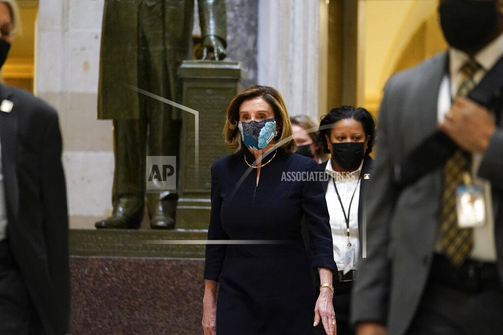 Susan Walsh Speaker of the House Nancy Pelosi of Calif., walks through Statuary Hall on Capitol Hill in Washington, Wednesday, Jan. 13, 2021. (AP Photo/Susan Walsh)