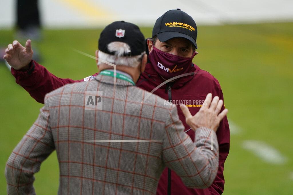 Susan Walsh Washington Football Team owner Dan Snyder, right, greeting Dr. James Andrews, left, on the field before the start of an NFL football game, Sunday, Oct. 25, 2020, in Landover, Md. (AP Photo/Susan Walsh)