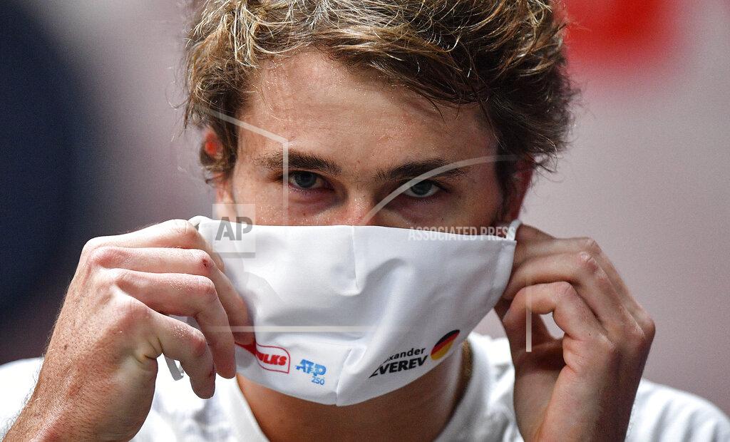 Martin Meissner Germany's Alexander Zverev puts on a face mask after winning the ATP bett1HULKS Championship tennis final against Argentina's Diego Schwartzmann in Cologne, Germany, Sunday, Oct. 25, 2020. Zverev defeated Schwartzmann 6-2, 6-1. (AP Photo/Martin Meissner)