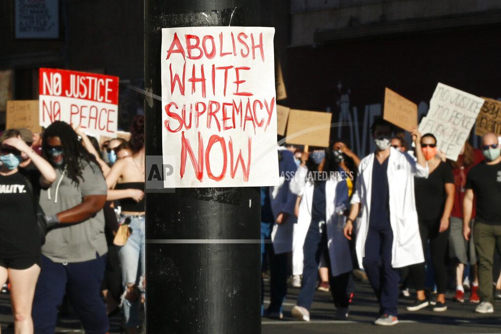 Rich Pedroncelli Demonstrators march through downtown Sacramento, Calif., Tuesday, June 2, 2020, protesting the death of George Floyd. Floyd, a black man, died after being restrained by Minneapolis police officers on May 25. (AP Photo/Rich Pedroncelli)
