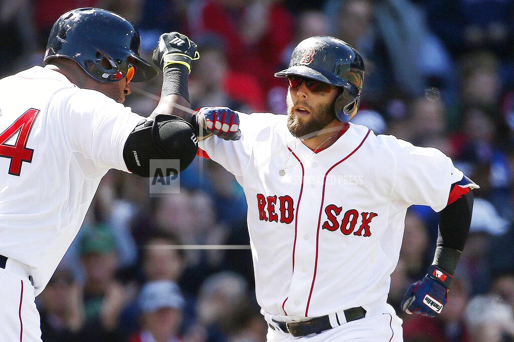 Michael Dwyer FILE - In this May 2, 2015, file photo, Boston Red Sox's Dustin Pedroia, right, celebrates his solo home run with teammate David Ortiz during the fourth inning of a baseball game against the New York Yankees in Boston. Pedroia, who was the 2007 Rookie of the Year and the AL MVP in his second season, retired Monday, Feb. 1, 2021. (AP Photo/Michael Dwyer, File)