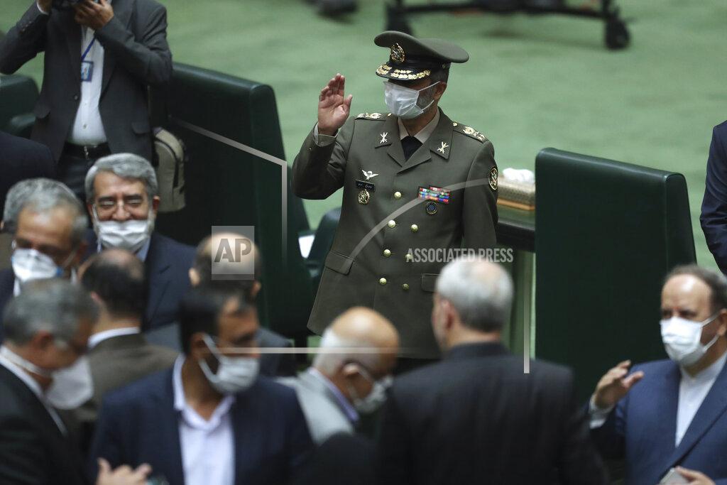 Vahid Salemi Commander of the Iranian Army Gen. Abdolrahim Mousavi wears a protective face mask to help prevent the spread of the coronavirus waves as he arrives for the inauguration of the new parliament, in Tehran, Iran, Wednesday, May, 27, 2020. Iran has convened its newly elected parliament, dominated by conservative lawmakers and under strict social distancing regulations, as the country struggles to curb the spread of coronavirus that has hit the nation hard. Iran is grappling with one of the deadliest outbreaks in the Middle East. (AP Photo/Vahid Salemi)
