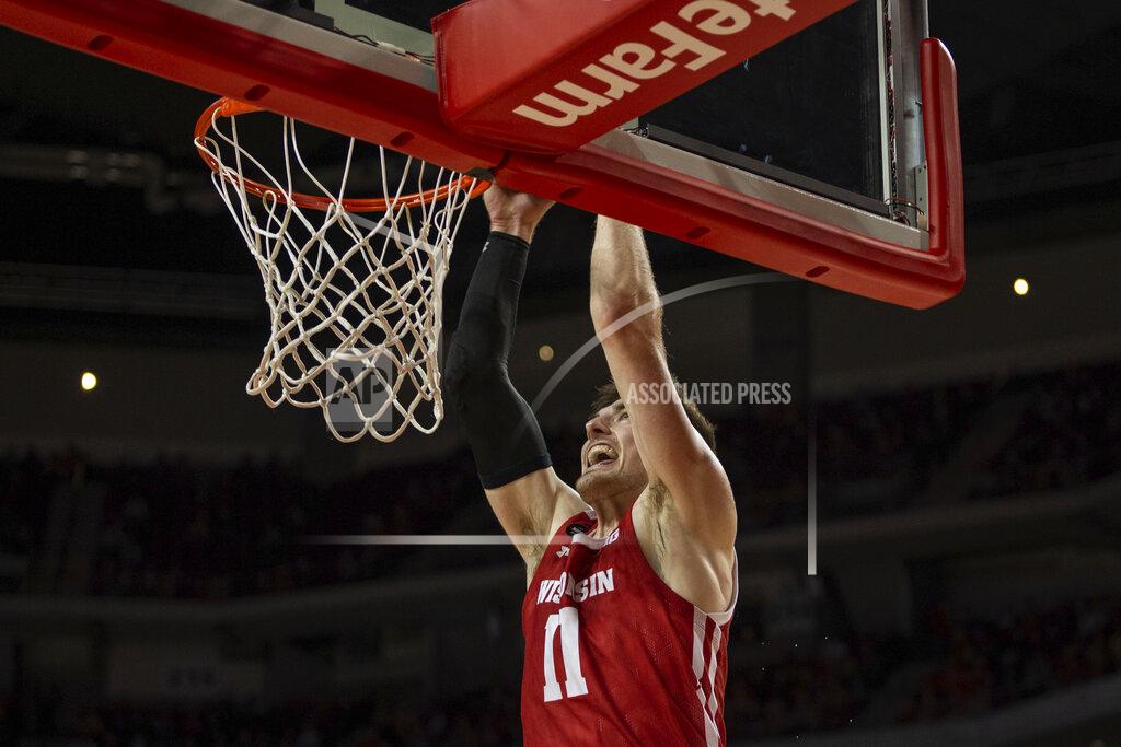 John Peterson Wisconsin forward Micah Potter (11) makes a dunk against Nebraska during the first half of an NCAA college basketball game in Lincoln, Neb., Saturday, Feb. 15, 2020. (AP Photo/John Peterson)
