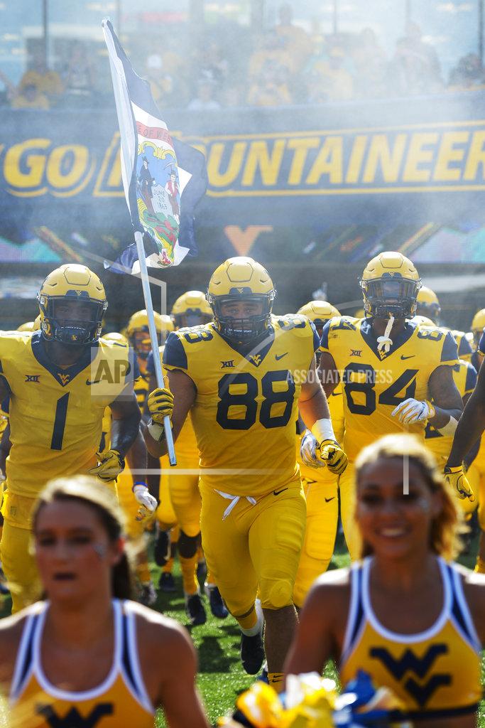 Craig Hudson West Virginia Mountaineers tight end Trevon Wesco (88) carries the flag of West Virginia as the Mountaineers take to the field to play against the University of Kansas Jayhawks in Morgantown, W. Va., Saturday Oct. 6, 2018. (AP Photo/Craig Hudson)