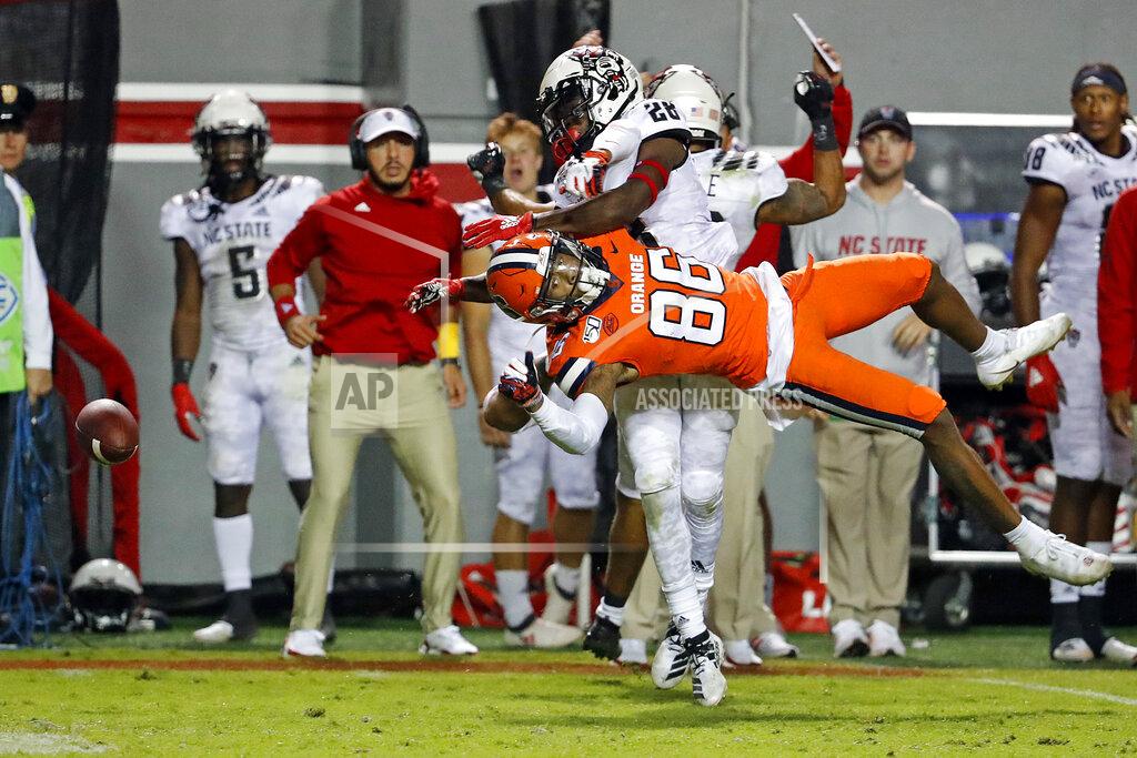 Karl B Deblaker North Carolina State's Kishawn Miller (28) keeps Syracuse's Trishton Jackson (86) from catching a pass during the second half of an NCAA college football game in Raleigh, N.C., Thursday, Oct. 10, 2019. (AP Photo/Karl B DeBlaker)