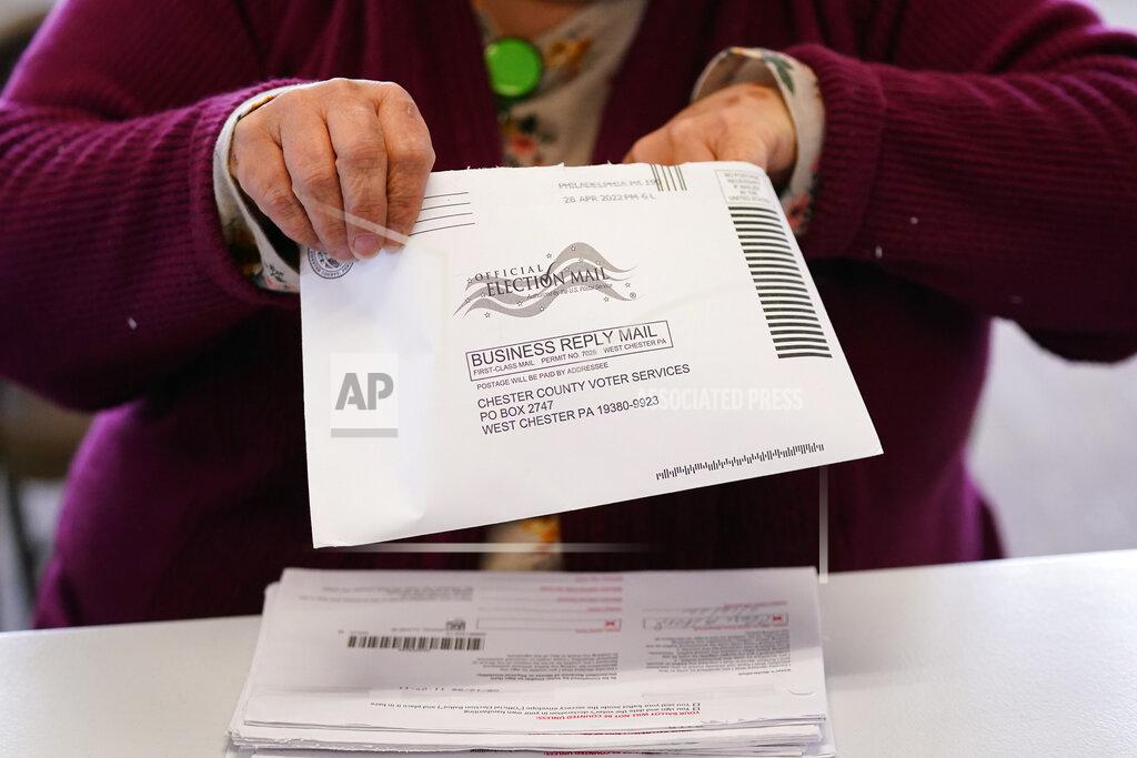 Matt Slocum Election worker Monica Ging processes a ballot for the Pennsylvania primary election at the Chester County Voter Services office, Thursday, May 19, 2022, in West Chester, Pa. (AP Photo/Matt Slocum)