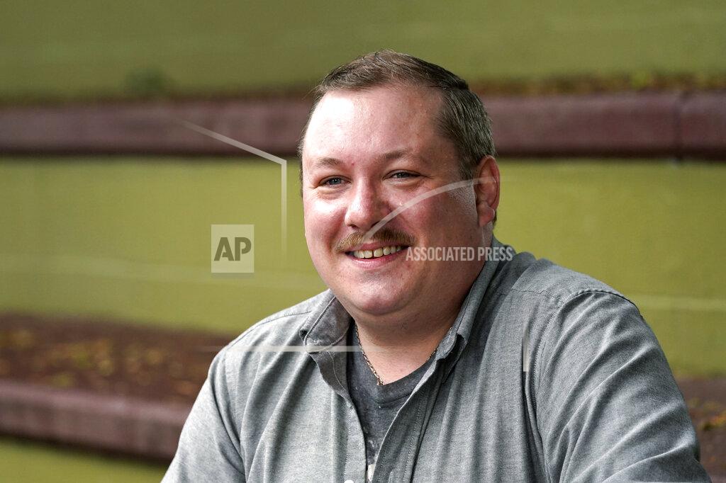 Elaine Thompson Nate Mullins, a former bartender from Oak, Harbor, Wash., who quit his job last November after clashing with managers over enforcing mask rules, poses for a photo Monday, May 17, 2021, in Mount Vernon, Wash. There's a wild card in the push to return to post-pandemic life: many workers don't want to return to the jobs they once had. Mullins' unemployment checks don't match what he was making at the bar, but they're enough to get by while he looks for jobs that would provide health care and retirement benefits. (AP Photo/Elaine Thompson)