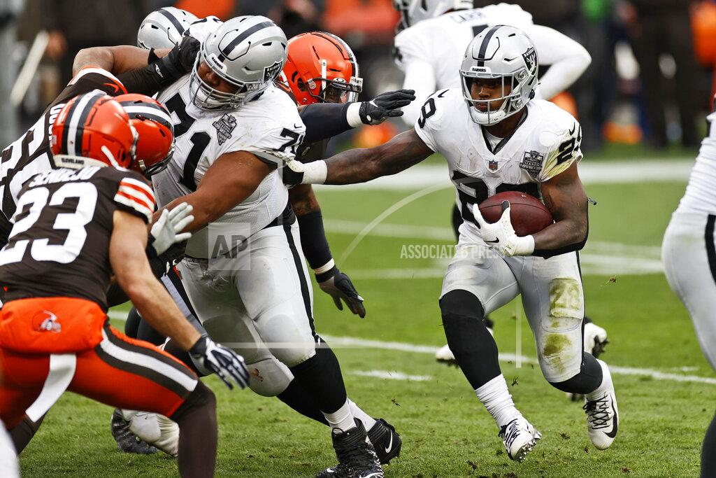 Ron Schwane Las Vegas Raiders running back Josh Jacobs (28) rushes during the first half of an NFL football game against the Cleveland Browns, Sunday, Nov. 1, 2020, in Cleveland. (AP Photo/Ron Schwane)