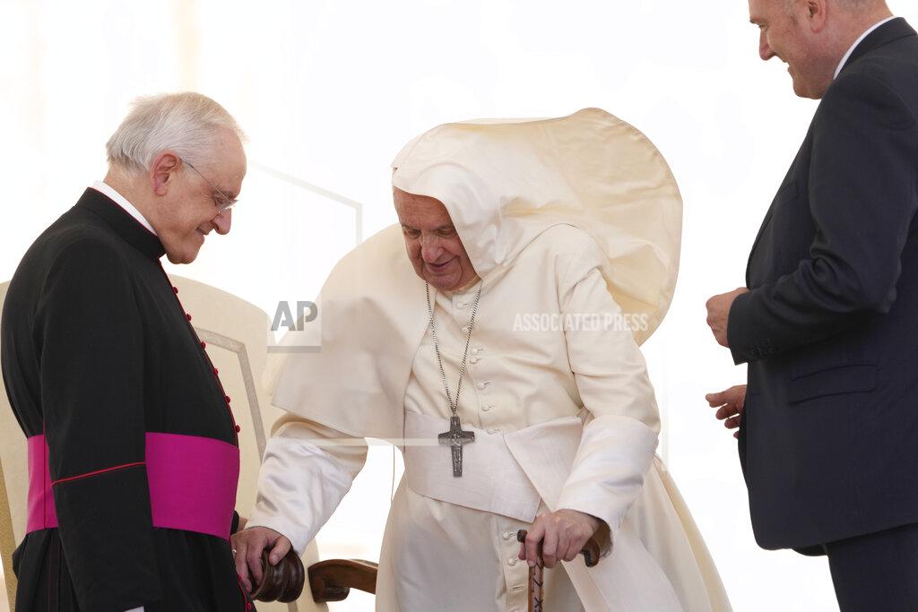 Andrew Medichini A gust of wind blows Pope Francis' mantle as he leaves at the end of his weekly general audience in St. Peter's Square, at the Vatican, Wednesday, May 25, 2022. (AP Photo/ Andrew Medichini)