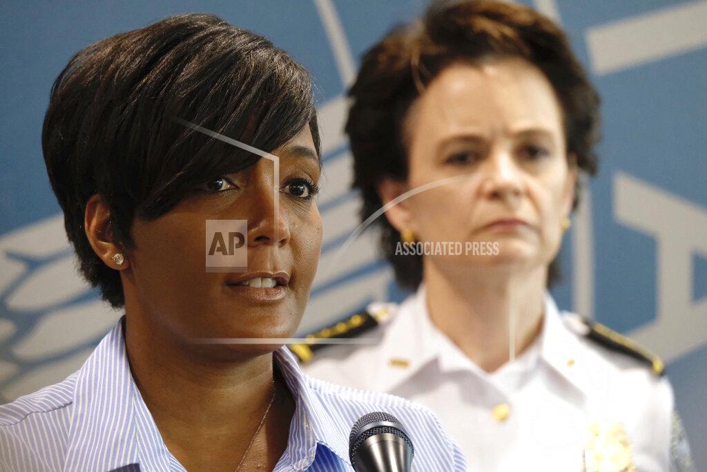 Ben Gray Atlanta Mayor Keisha Lance Bottoms announces a 9 p.m. curfew as protests continue over the death of George Floyd, Saturday, May 30, 2020, in Atlanta. Protests were held in U.S. cities over the death of Floyd, a black man who died after being restrained by Minneapolis police officers on May 25. (Ben Gray/Atlanta Journal-Constitution via AP)