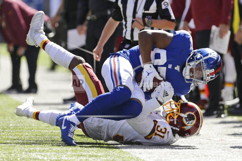 Adam Hunger New York Giants' Sterling Shepard, top, is tackled by Washington Redskins' Fabian Moreau during the first half of an NFL football game, Sunday, Sept. 29, 2019, in East Rutherford, N.J. (AP Photo/Adam Hunger)