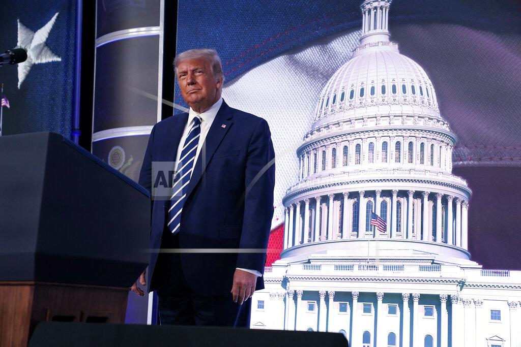 Evan Vucci President Donald Trump stands on stage during the 2020 Council for National Policy Meeting, Friday, Aug. 21, 2020, in Arlington, Va. (AP Photo/Evan Vucci)