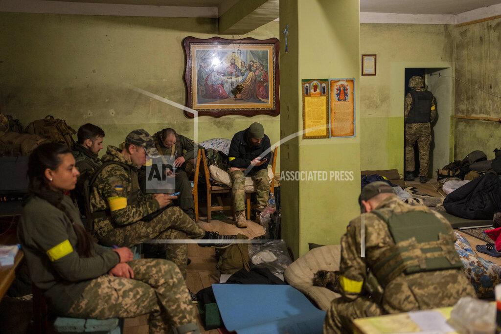 Bernat Armangue Ukrainian National Guard soldiers take a break in a house used as temporary base in a recently retaken village on the outskirts of Kharkiv, east Ukraine, Saturday, May 14, 2022. (AP Photo/Bernat Armangue)