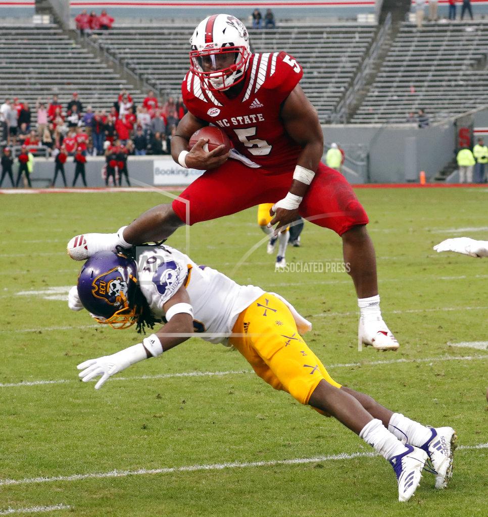 Chris Seward North Carolina State's Damontay Rhem (5) hurdles over East Carolina's Gerard Stringer (30) as he runs upfield during the second half of NCAA college football game in Raleigh, N.C., Saturday, Dec. 1, 2018. N.C. (AP Photo/Chris Seward)