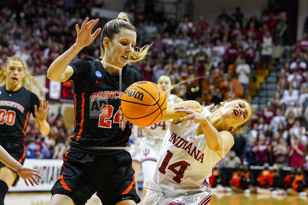 Michael Conroy Indiana guard Ali Patberg (14) looses the ball as she drives past Princeton guard Julia Cunningham (24) in the second half of a college basketball game in the second round of the NCAA tournament in Bloomington, Ind., Monday, March 21, 2022. Indiana defeated Princeton 56-55. (AP Photo/Michael Conroy)