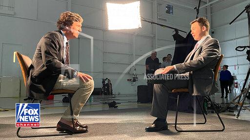 In this image from undated video, Kyle Rittenhouse, right, sits for an interview with Fox News host Tucker Carlson. Rittenhouse was acquitted on charges stemming from killing two men and wounding another during the unrest that followed the shooting of a Black man by a white police officer, in Kenosha, Wis. (Courtesy of Fox News via AP)