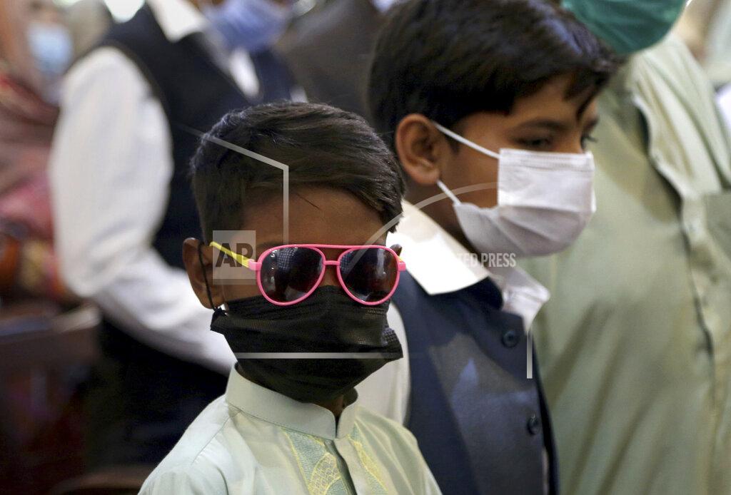 Muhammad Sajjad A Christian boy attends an Easter mass with others the a St. John's Cathedral, in Peshawar, Pakistan, Sunday, April 4, 2021. (AP Photo/Muhammad Sajjad)