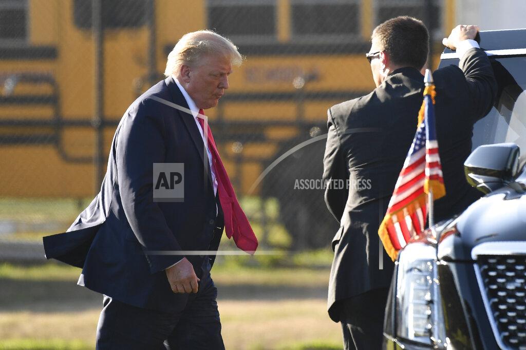 President Donald Trump walks to his car after arrive in Southampton, N.Y., on Marine One, Saturday, Aug. 8, 2020. Trump is attending two fundraisers during his visit to the Hamptons. (AP Photo/Susan Walsh)