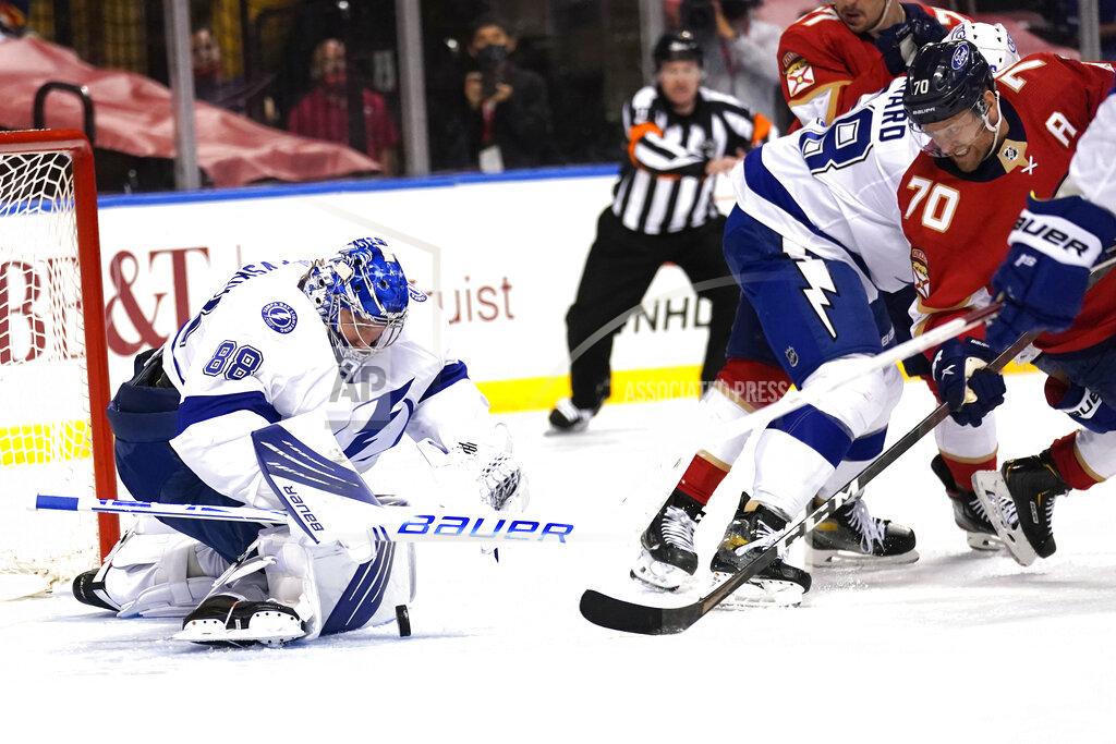 Lynne Sladky Tampa Bay Lightning goaltender Andrei Vasilevskiy (88) goes against Florida Panthers right wing Patric Hornqvist (70) as he stops a shot on the goal during the second period in Game 5 of an NHL hockey Stanley Cup first-round playoff series, Monday, May 24, 2021, in Sunrise, Fla. (AP Photo/Lynne Sladky)