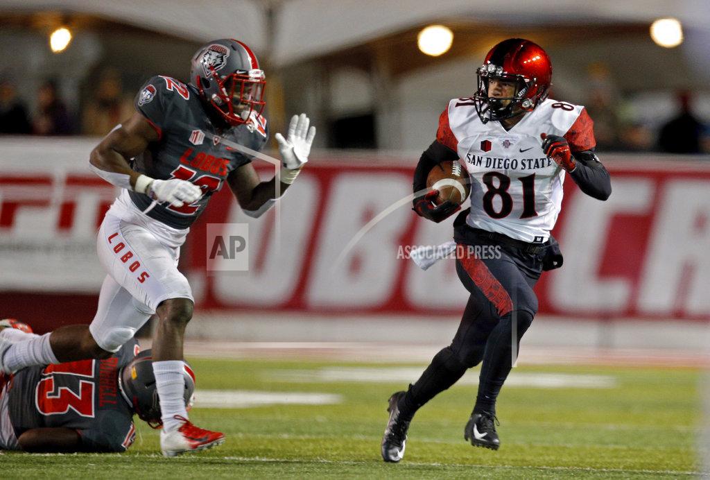 Andres Leighton San Diego State wide receiver Ethan Dedeaux (81) looks back at New Mexico safety Patrick Peek (12) during the first half of an NCAA college football game in Albuquerque, N.M., Saturday, Nov. 3, 2018. (AP Photo/Andres Leighton)