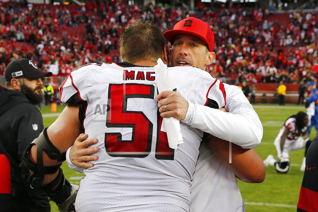 John Hefti San Francisco 49ers head coach Kyle Shanahan, right, hugs Atlanta Falcons center Alex Mack (51) after an NFL football game in Santa Clara, Calif., Sunday, Dec. 15, 2019. (AP Photo/John Hefti)