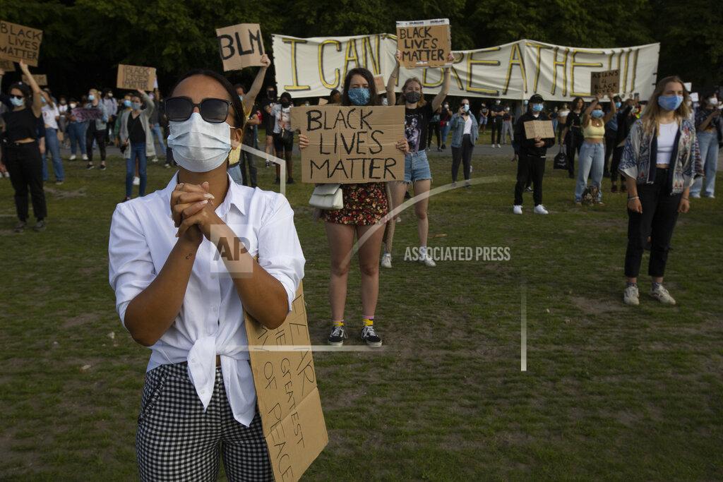Peter Dejong People observe social distancing as they take part in a demonstration in The Hague, Netherlands, Tuesday, June 2, 2020, to protest against the recent killing of George Floyd, police violence and institutionalized racism. Floyd, a black man, died in police custody in Minneapolis, U.S.A., after being restrained by police officers on Memorial Day. (AP Photo/Peter Dejong)