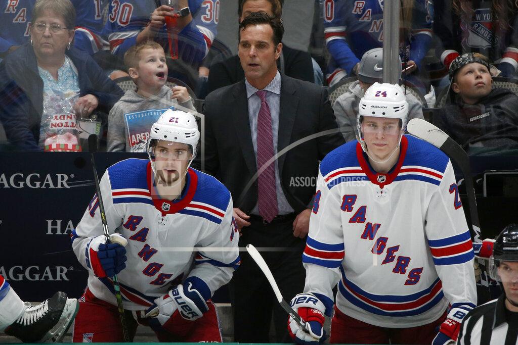 Michael Ainsworth FILE - New York Rangers head coach David Quinn watches his team play against the Dallas Stars with center Brett Howden (21) and right wing Kaapo Kakko (24) during the third period of an NHL hockey game in Dallas, in this Tuesday, March 10, 2020, file photo. The New York Rangers fired coach David Quinn and three assistant coaches Wednesday, May 12, 2021, after missing the playoffs with one of the NHL's up-and-coming young teams. (AP Photo/Michael Ainsworth, File)