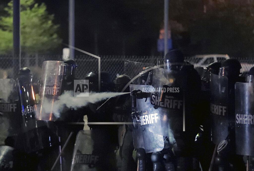 Shelby County Sheriff's deputies pepper spray a crowd of demonstrators advancing on the Hernando Desoto Bridge in Memphis, Tennessee, early Monday, June 1, 2020, as they protest the death of George Floyd in Minneapolis police custody May 25, 2020. (Daily Memphian via AP)